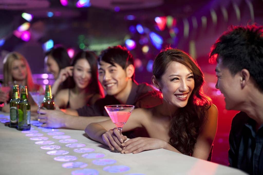 Stylish young people at bar counter